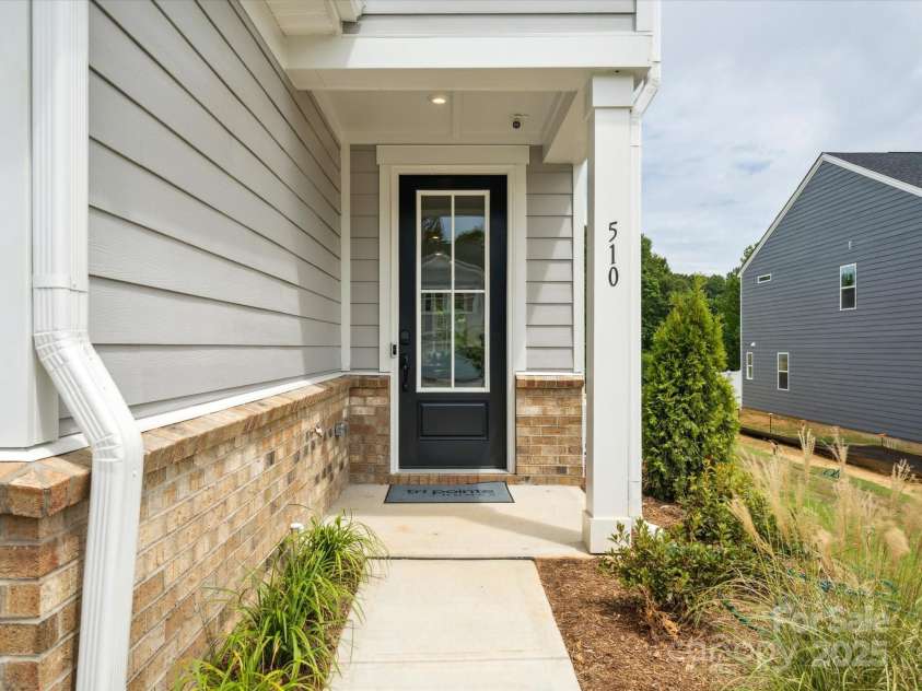 619 Webster Lane, Cramerton, NC 28032.  MLS# CAR4322006, YatesRealty ID 1150. Covered Front Entry.  *Model Photos | Actual Finishes, Structural Selections, and Orientation May Vary.