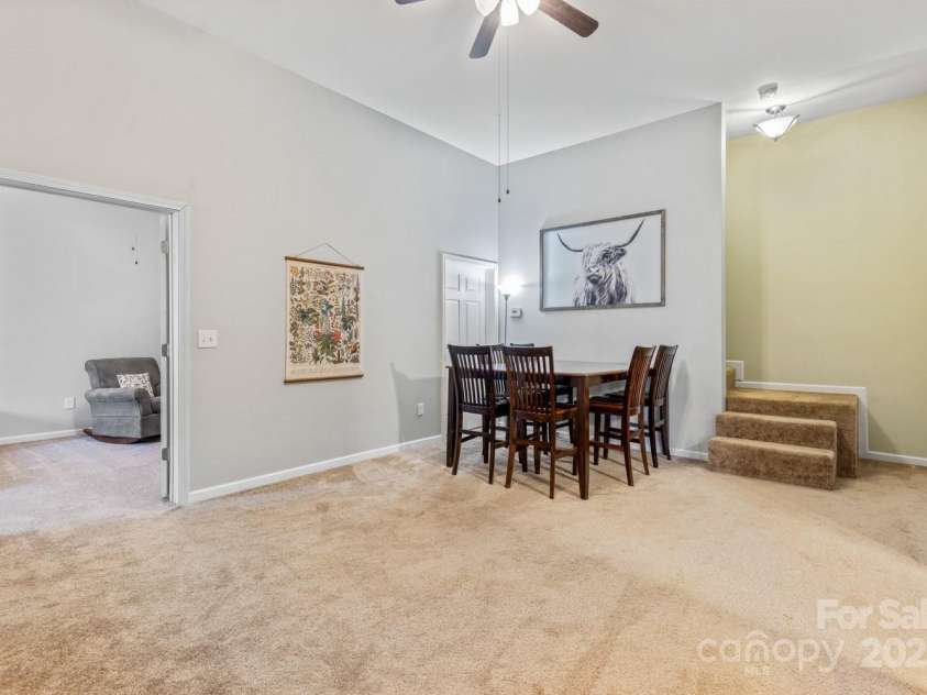 77 Stratford Place, Sylva, NC 28779.  MLS# CAR4219612, YatesRealty ID 11507. Lower level living area with exterior exit to deck