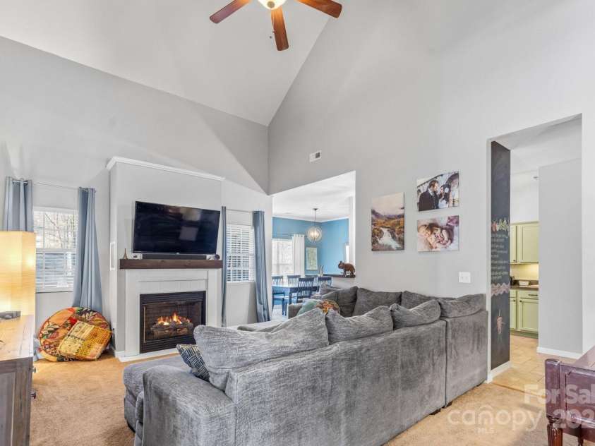 77 Stratford Place, Sylva, NC 28779.  MLS# CAR4219612, YatesRealty ID 11507. Main living space with vaulted ceilings