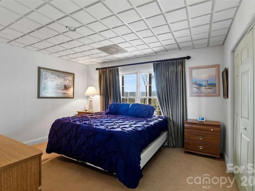 1244 Windover Drive, Brevard, NC 28712.  MLS# CAR4367852, YatesRealty ID 11508. Lower Level Bedroom
