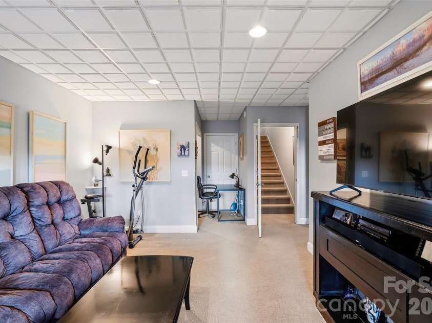 1244 Windover Drive, Brevard, NC 28712.  MLS# CAR4367852, YatesRealty ID 11508. Lower Level Living Room