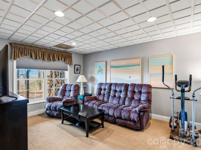 1244 Windover Drive, Brevard, NC 28712.  MLS# CAR4367852, YatesRealty ID 11508. Lower Level Living Room