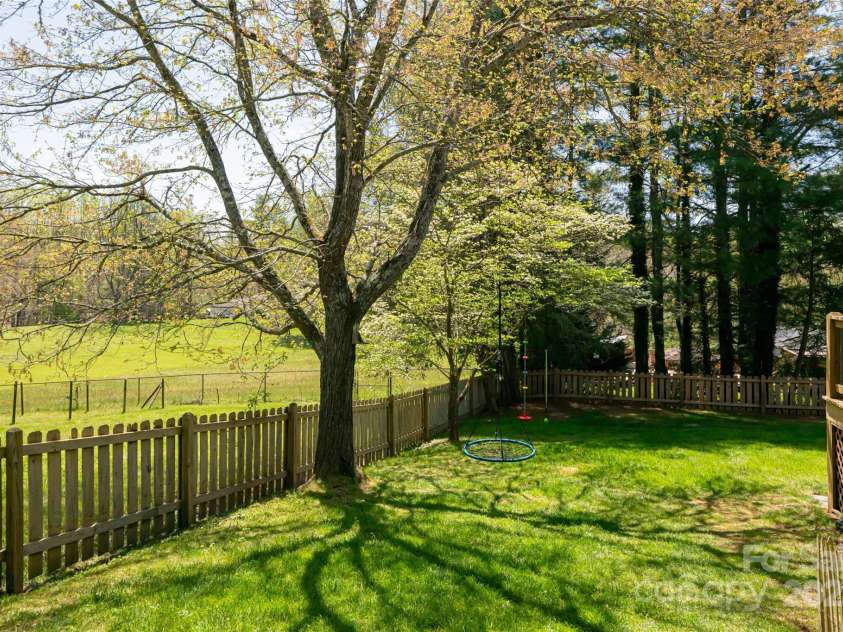 77 Roberts Ridge Drive, Etowah, NC 28729.  MLS# CAR4241039, YatesRealty ID 11510. Back yard