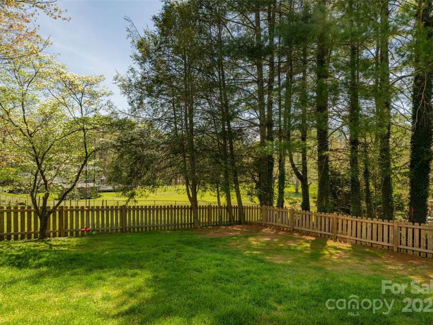 77 Roberts Ridge Drive, Etowah, NC 28729.  MLS# CAR4241039, YatesRealty ID 11510. Back yard