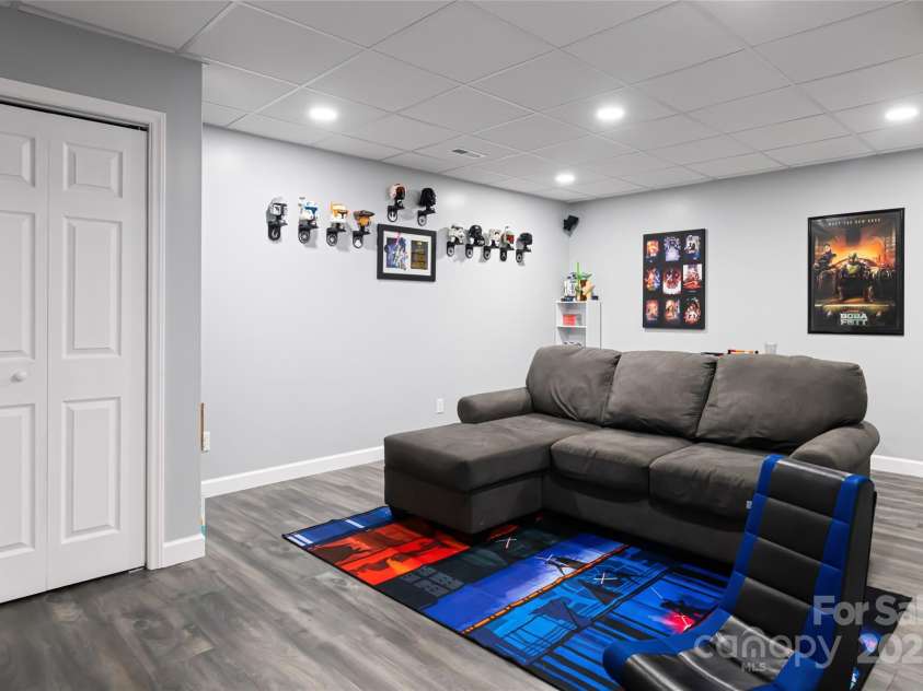 77 Roberts Ridge Drive, Etowah, NC 28729.  MLS# CAR4241039, YatesRealty ID 11510. Finished basement area