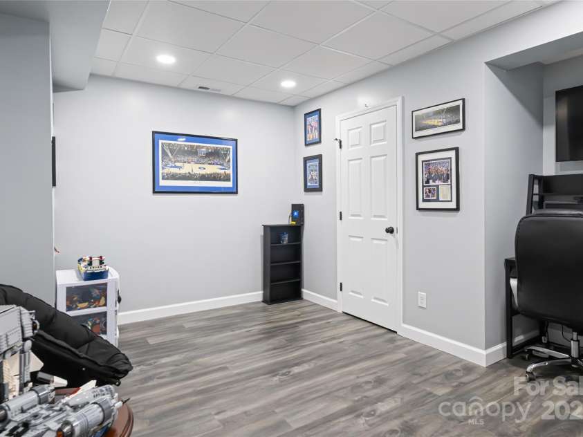 77 Roberts Ridge Drive, Etowah, NC 28729.  MLS# CAR4241039, YatesRealty ID 11510. Finished basement area