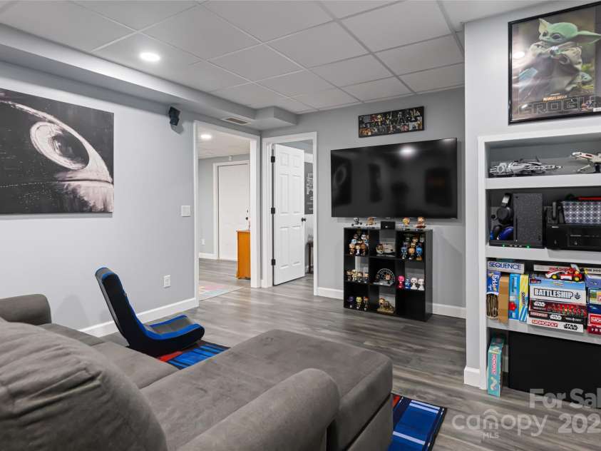 77 Roberts Ridge Drive, Etowah, NC 28729.  MLS# CAR4241039, YatesRealty ID 11510. Finished basement area