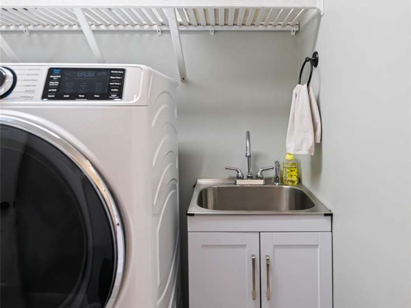 77 Roberts Ridge Drive, Etowah, NC 28729.  MLS# CAR4241039, YatesRealty ID 11510. Laundry room with utility sink
