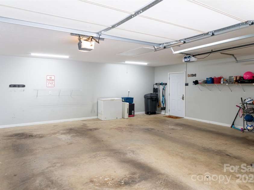 77 Roberts Ridge Drive, Etowah, NC 28729.  MLS# CAR4241039, YatesRealty ID 11510. Main level garage
