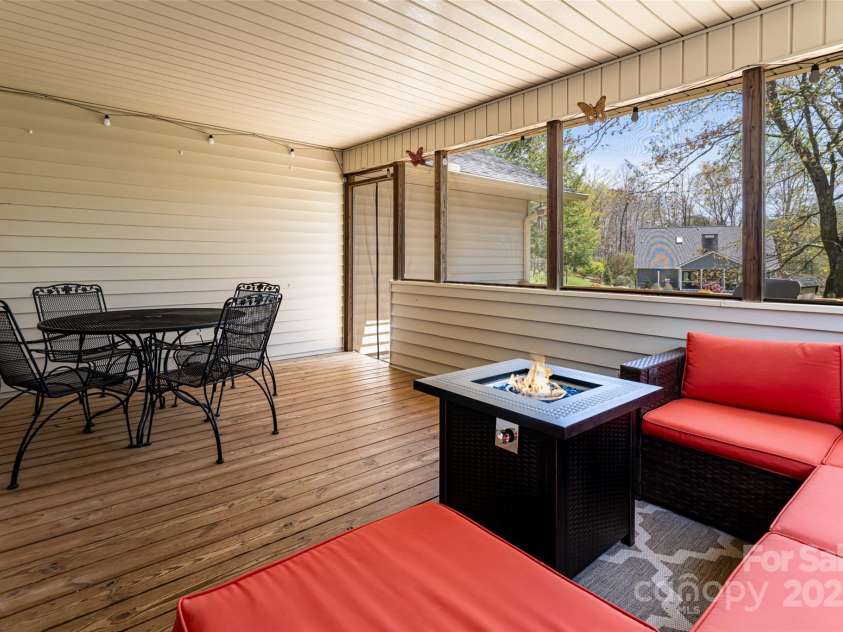 77 Roberts Ridge Drive, Etowah, NC 28729.  MLS# CAR4241039, YatesRealty ID 11510. Screened in back porch