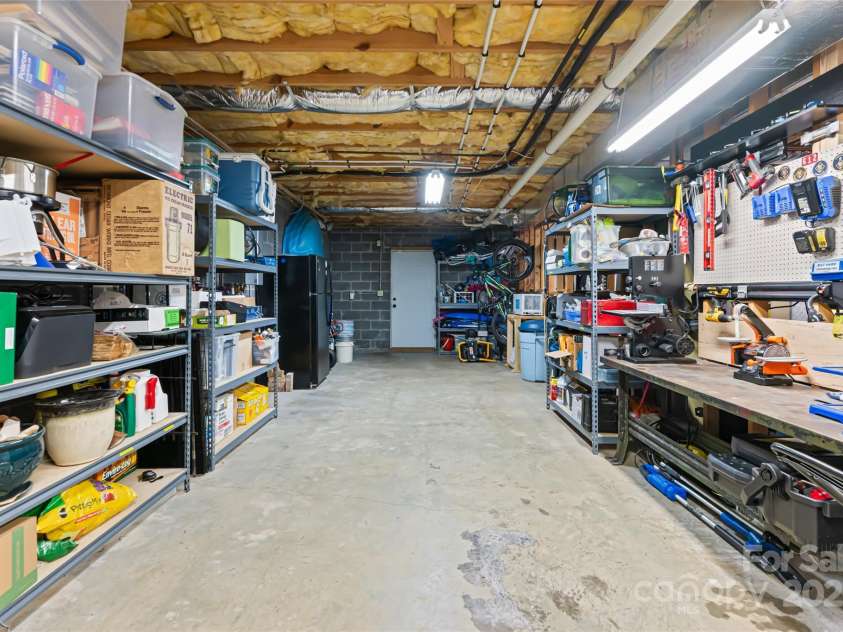 77 Roberts Ridge Drive, Etowah, NC 28729.  MLS# CAR4241039, YatesRealty ID 11510. Unfinished basement