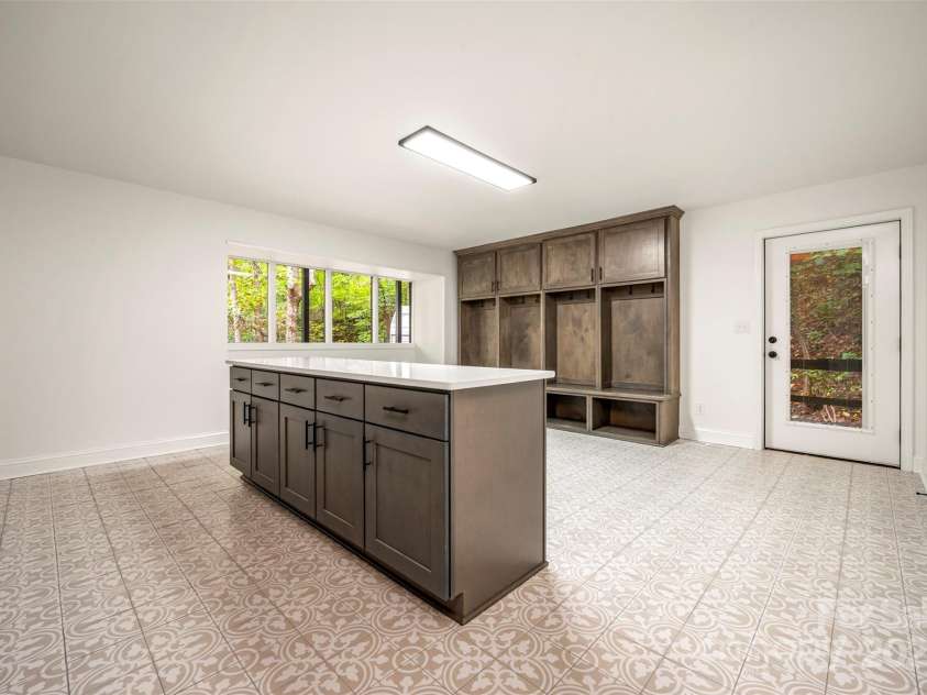 160 Lasae Lane, Tryon, NC 28782.  MLS# CAR4308669, YatesRealty ID 11520. Lower Level Laundry/Mud Room