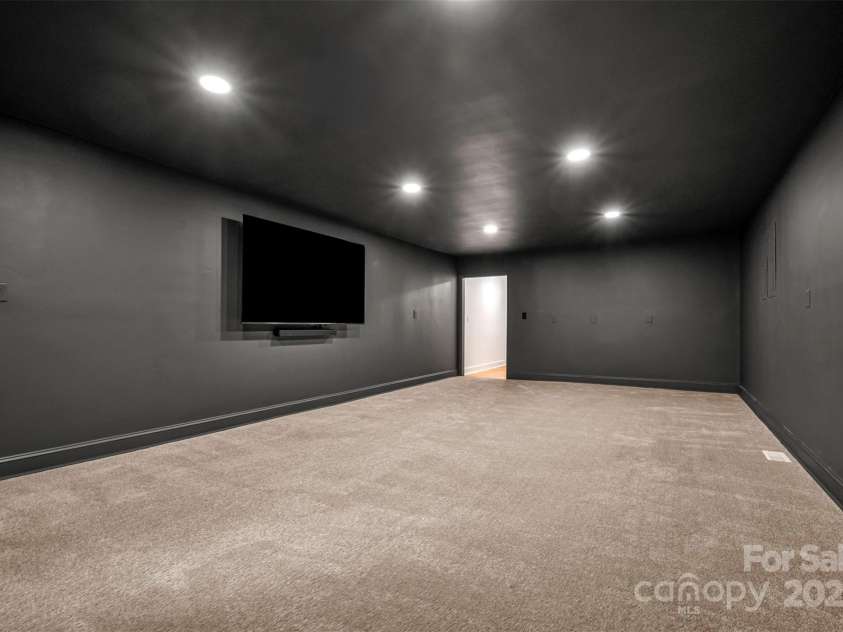 160 Lasae Lane, Tryon, NC 28782.  MLS# CAR4308669, YatesRealty ID 11520. Oversized Media Room
