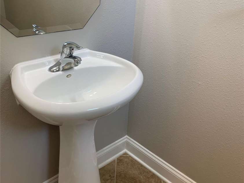 11622 Lioness Street, Charlotte, NC 28273.  MLS# CAR4254241, YatesRealty ID 11524. 1/2 Bath main level. Ceramic tile, pedestal sink.