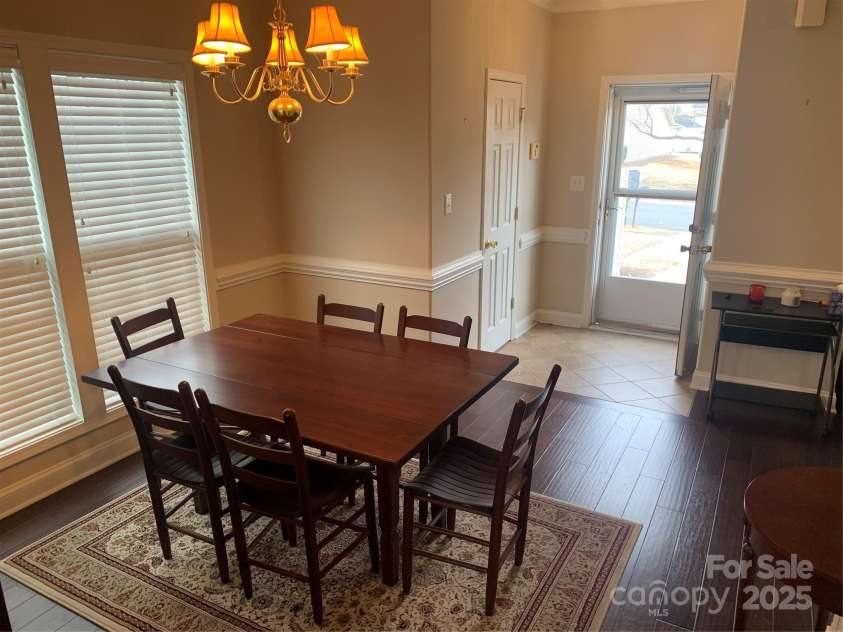 11622 Lioness Street, Charlotte, NC 28273.  MLS# CAR4254241, YatesRealty ID 11524. Dining room. Photo taken before we replaced the light shades and painted.