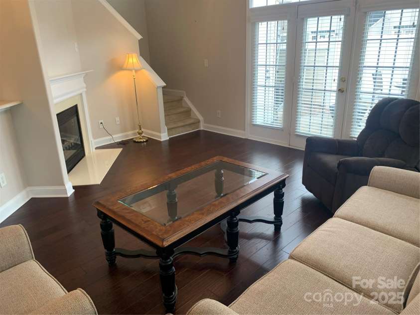 11622 Lioness Street, Charlotte, NC 28273.  MLS# CAR4254241, YatesRealty ID 11524. Great room with French doors to enclosed patio. Notice the transom window. New window in 2025.