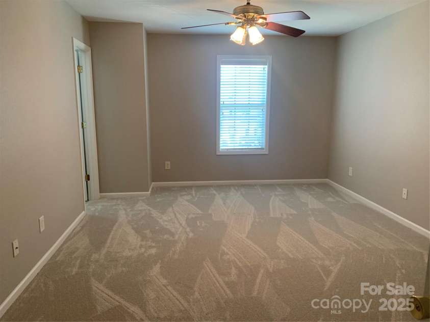 11622 Lioness Street, Charlotte, NC 28273.  MLS# CAR4254241, YatesRealty ID 11524. Primary Suite#2- great for room mates, family, or guests. Both suites feature Hunter ceiling fans.