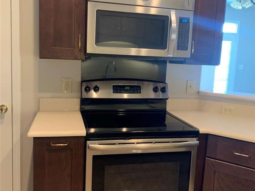 11622 Lioness Street, Charlotte, NC 28273.  MLS# CAR4254241, YatesRealty ID 11524. The slide out cabinet to the left of the stove features a Spice Rack.
