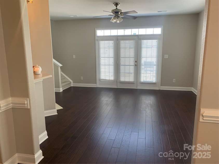 11622 Lioness Street, Charlotte, NC 28273.  MLS# CAR4254241, YatesRealty ID 11524. The triple French door leads to the enclosed patio. (Only the middle door opens. The other two are stationary. There is a separate sliding screen door.