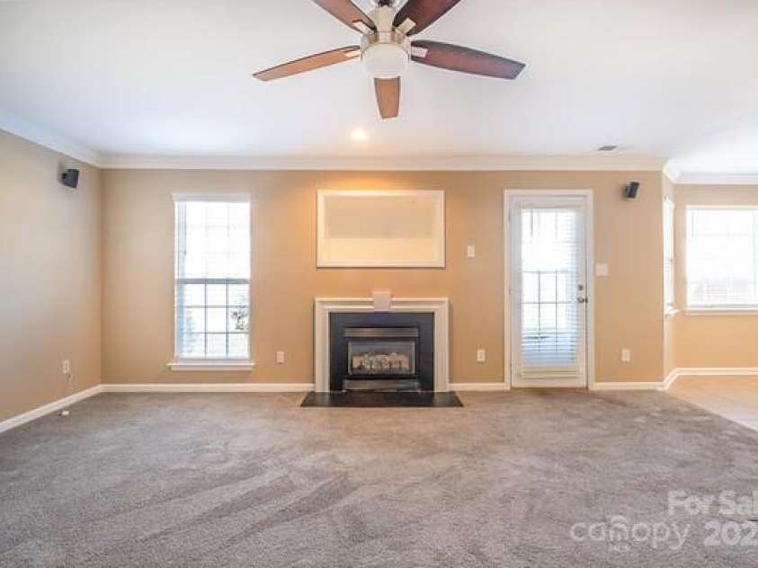 10146 Hawkeye Drive, Charlotte, NC 28273.  MLS# CAR4254398, YatesRealty ID 11525. Great Room with gas log fireplace