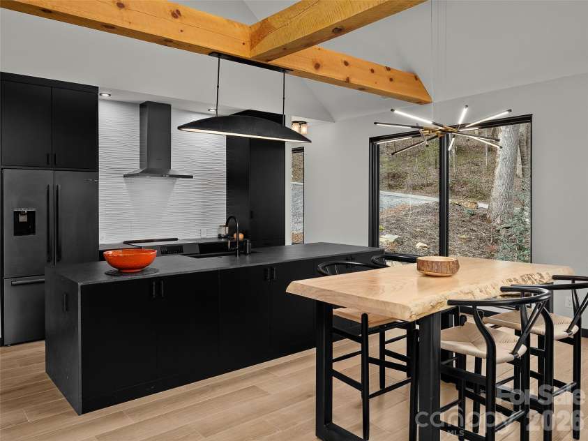 80 Hemlock Circle, Black Mountain, NC 28711.  MLS# CAR4367338, YatesRealty ID 11528. Dining Room into the kitchen