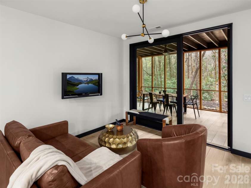80 Hemlock Circle, Black Mountain, NC 28711.  MLS# CAR4367338, YatesRealty ID 11528. Downstairs Living Room