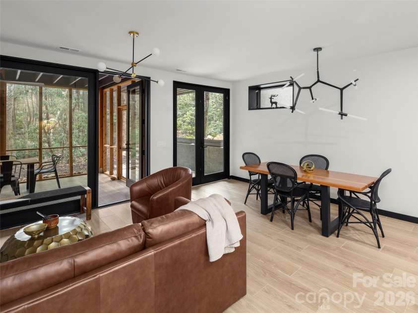 80 Hemlock Circle, Black Mountain, NC 28711.  MLS# CAR4367338, YatesRealty ID 11528. Downstairs Living Room and Dining Room