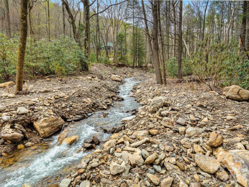 80 Hemlock Circle, Black Mountain, NC 28711.  MLS# CAR4367338, YatesRealty ID 11528. Enjoy this wonderful creek in the backyard