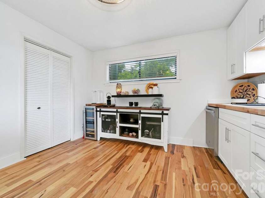216 Tinequa Drive, Brevard, NC 28712.  MLS# CAR4365636, YatesRealty ID 11539. Laundry is conveniently located in kitchen closet