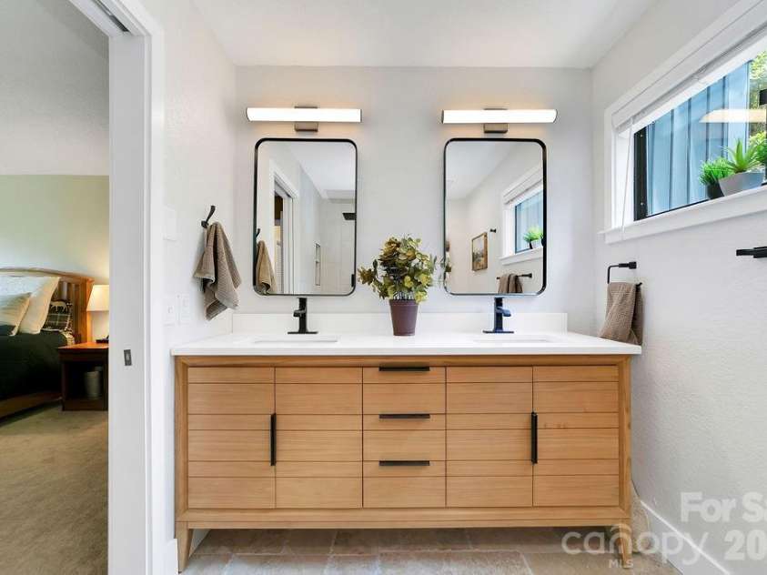 216 Tinequa Drive, Brevard, NC 28712.  MLS# CAR4365636, YatesRealty ID 11539. Stylish double vanity...
