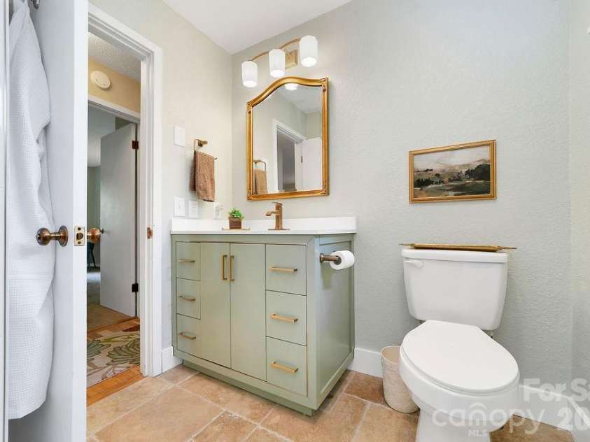 216 Tinequa Drive, Brevard, NC 28712.  MLS# CAR4365636, YatesRealty ID 11539. Stylish vanity & fixtures