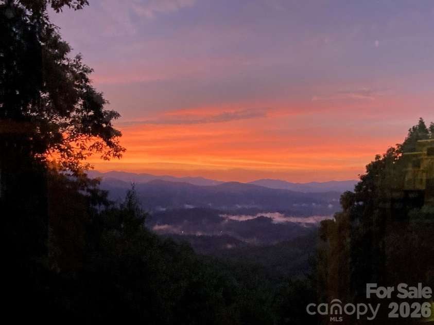 216 Tinequa Drive, Brevard, NC 28712.  MLS# CAR4365636, YatesRealty ID 11539. Sunset views over the mountains from the condo...