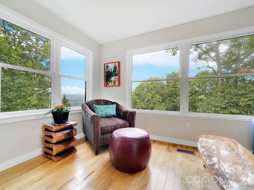 216 Tinequa Drive, Brevard, NC 28712.  MLS# CAR4365636, YatesRealty ID 11539. The sunroom is a secondary gathering spot...