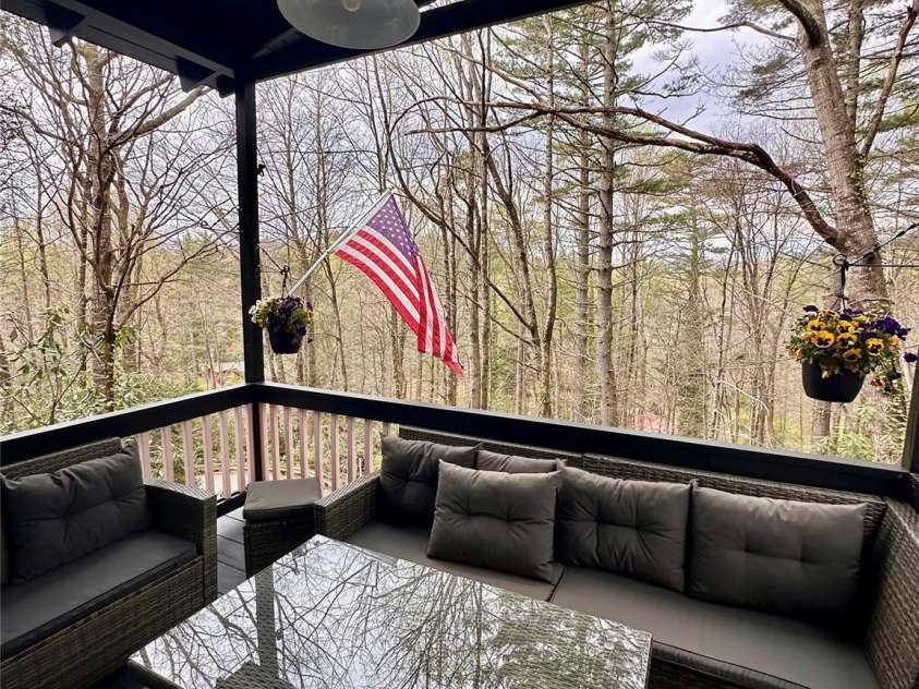 17 Village Way, Sapphire, NC 28774.  MLS# CAR4256593, YatesRealty ID 11545. Covered Porch off Living