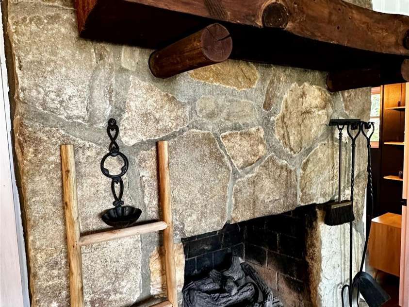 17 Village Way, Sapphire, NC 28774.  MLS# CAR4256593, YatesRealty ID 11545. Stone Fireplace