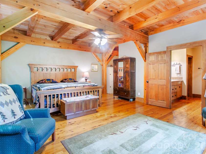 58 Great Aspen Way, Black Mountain, NC 28711.  MLS# CAR4366858, YatesRealty ID 11545. Another look at the primary bedroom. Note the bathroom on the right.