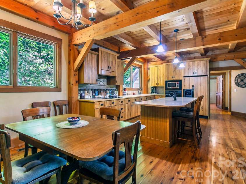 58 Great Aspen Way, Black Mountain, NC 28711.  MLS# CAR4366858, YatesRealty ID 11545. Another look at this beautiful kitchen that features a Zodiac quartz-topped island. That countertop is heat resistant to 500 degrees Fahrenheit and will not scratch.