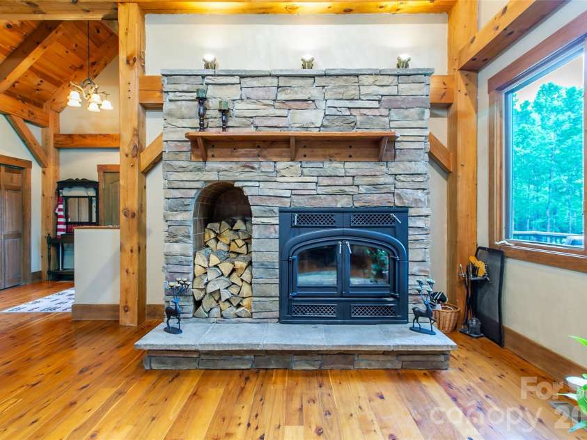 58 Great Aspen Way, Black Mountain, NC 28711.  MLS# CAR4366858, YatesRealty ID 11545. Imagine curling up in front of this heat-producing, wood-burning fireplace on chilly nights.