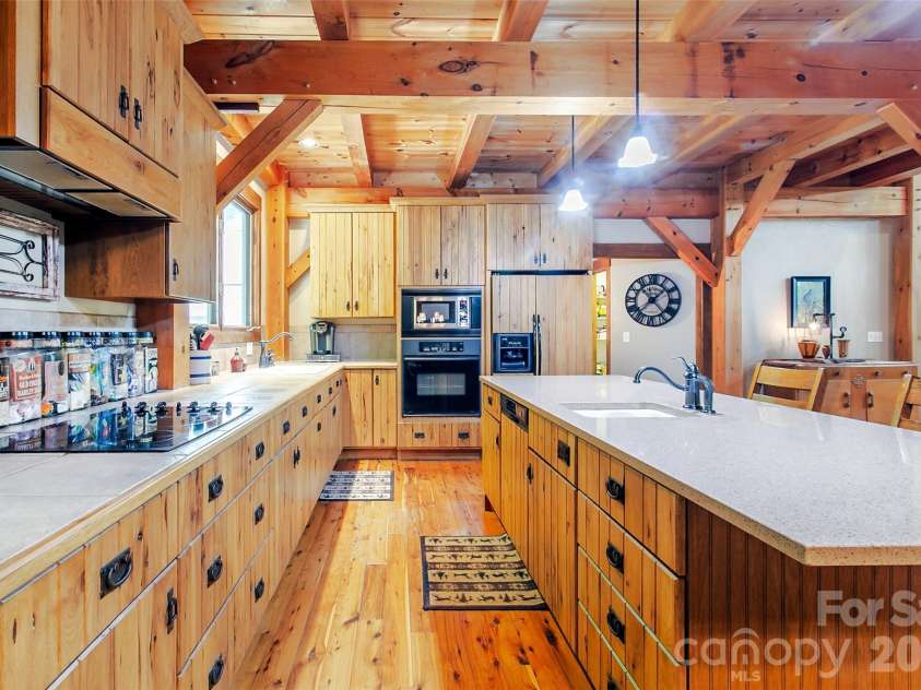58 Great Aspen Way, Black Mountain, NC 28711.  MLS# CAR4366858, YatesRealty ID 11545. Imagine yourself making gourmet or casual meals for family and friends in this light-filled kitchen.