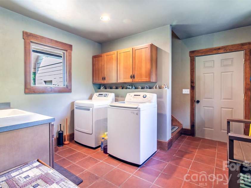 58 Great Aspen Way, Black Mountain, NC 28711.  MLS# CAR4366858, YatesRealty ID 11545. Laundry area on main floor between a full bath and the 2-car garage.