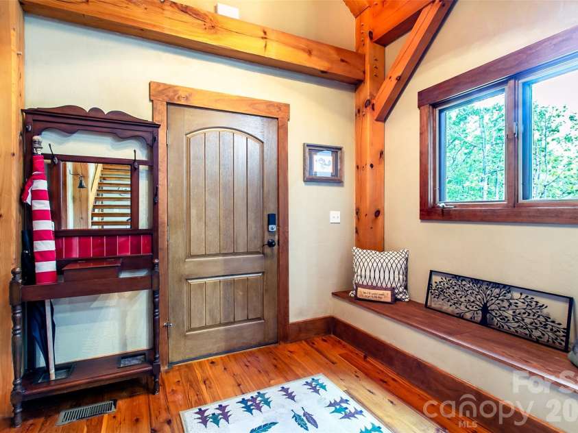 58 Great Aspen Way, Black Mountain, NC 28711.  MLS# CAR4366858, YatesRealty ID 11545. Once through the front door, you're in this lovely foyer.