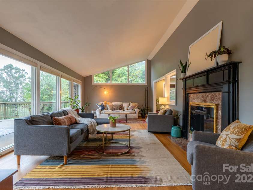 298 Town Mountain Road, Asheville, NC 28804.  MLS# CAR4256466, YatesRealty ID 11556. Extra large living room with so much natural light