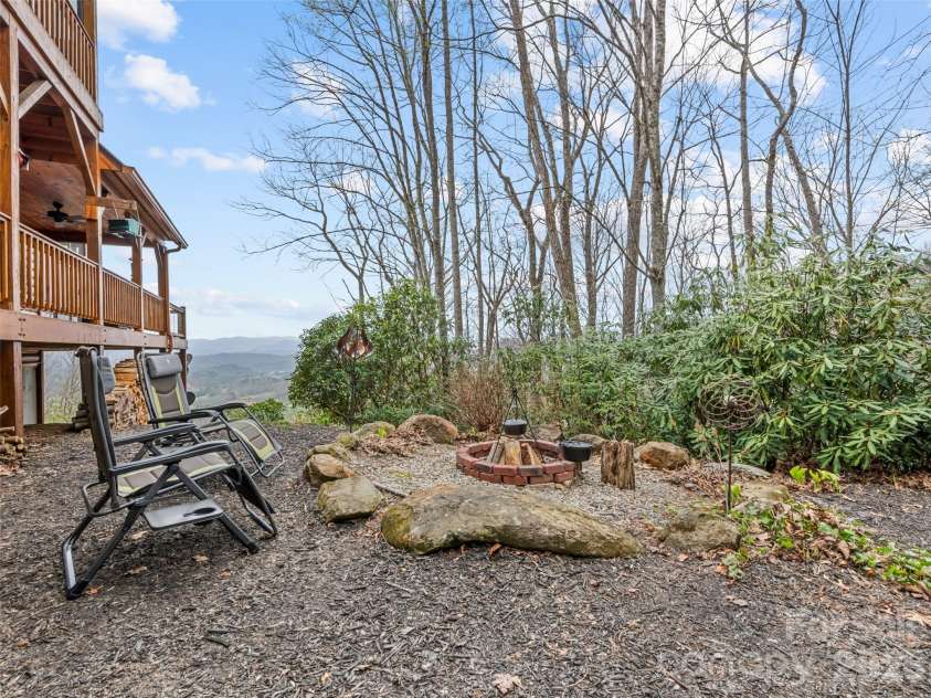 693 High Splendor Road, Robbinsville, NC 28771.  MLS# CAR4362499, YatesRealty ID 11558. Boulder-Lined Fire Pit