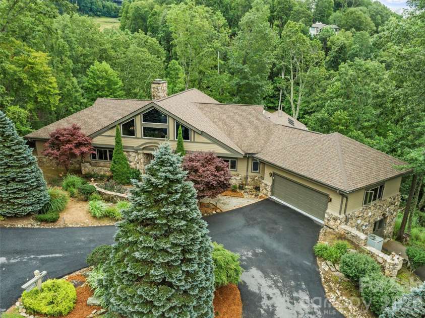 151 Austin Mountain Drive, Burnsville, NC 28714.  MLS# CAR4363639, YatesRealty ID 11563. Beautifully landscaped with long-range mountain views