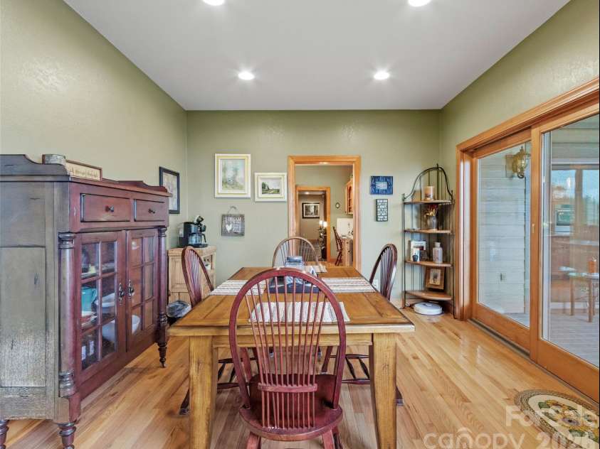 151 Austin Mountain Drive, Burnsville, NC 28714.  MLS# CAR4363639, YatesRealty ID 11563. Casual dining with deck & grilling access