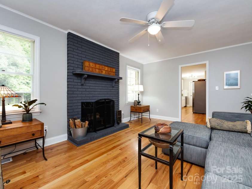 6616 Williams Road, Charlotte, NC 28215.  MLS# CAR4249256, YatesRealty ID 11574. Den with wood burning fireplace