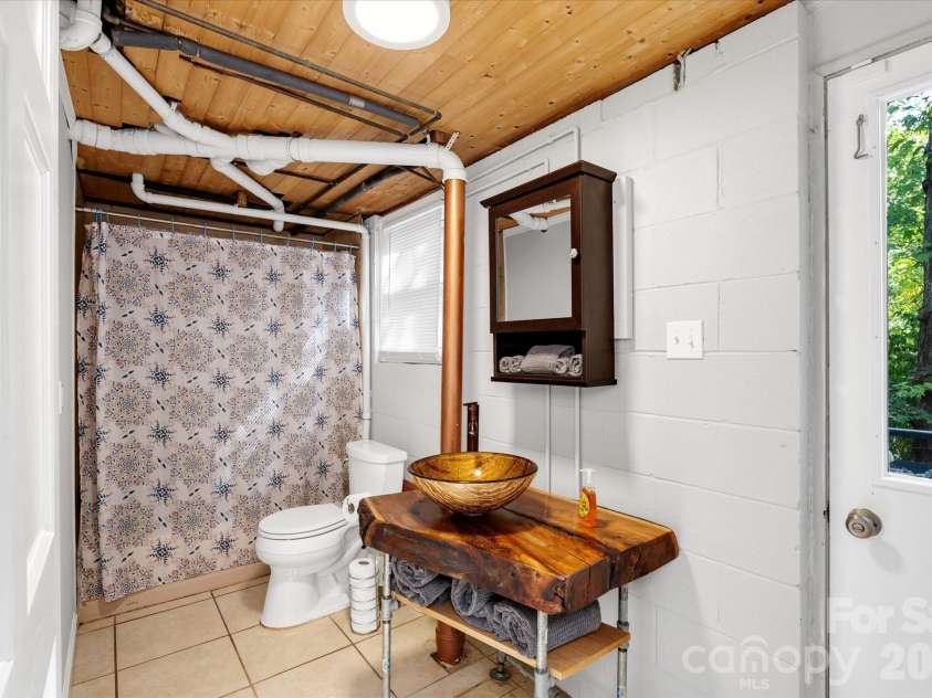 23 Springwood Drive, Asheville, NC 28805.  MLS# CAR4365304, YatesRealty ID 11575. Downstairs full bathroom