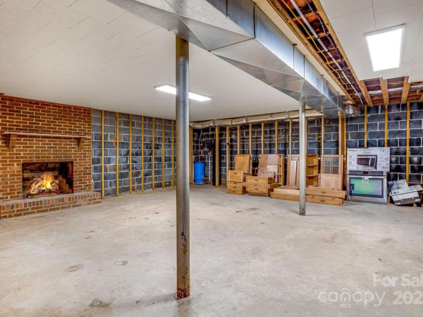 95 Hunters Ridge Road, Mills River, NC 28759.  MLS# CAR4244333, YatesRealty ID 11576. Basement flex space with wine cellar.