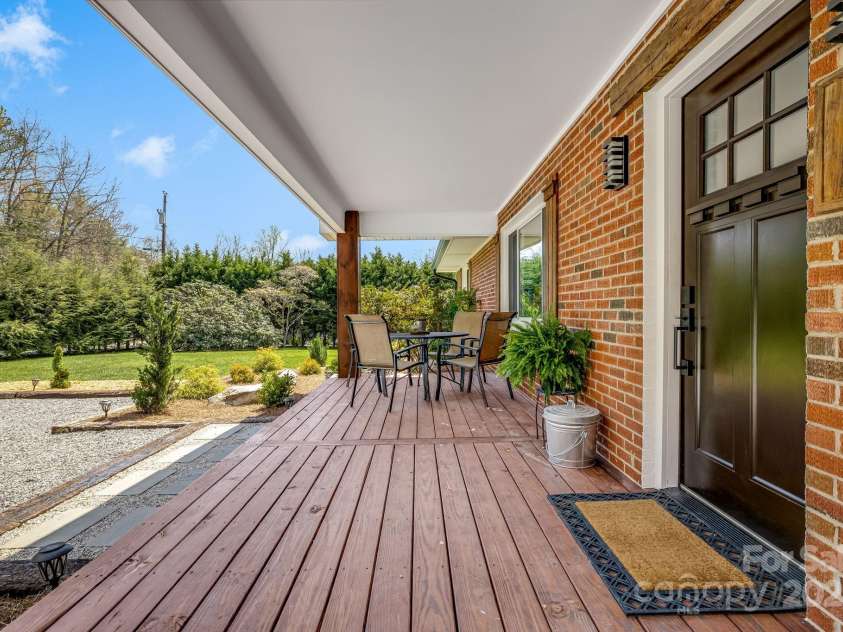 95 Hunters Ridge Road, Mills River, NC 28759.  MLS# CAR4244333, YatesRealty ID 11576. Front porch