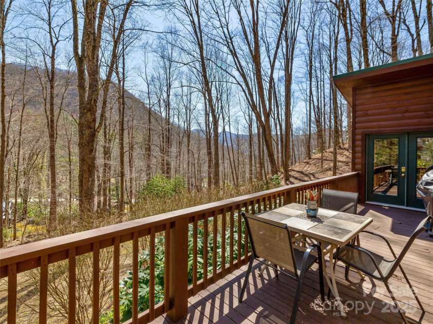 71 Honeymoon Lane, Maggie Valley, NC 28751.  MLS# CAR4240026, YatesRealty ID 11581. Extend your living space outdoors with this spacious deck and take in the mountain views